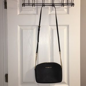 Black and gold Michael Kors cross body bag